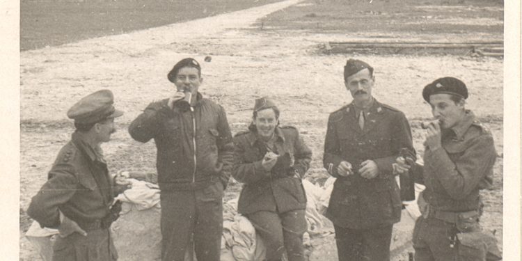 Document: Enver Hoxha with his Staff is located in the center where he is guarded by non-commissioned officers and English soldiers equipped with broadcast radios. Elements of kurveleshas have been assigned to guard this Headquarters
